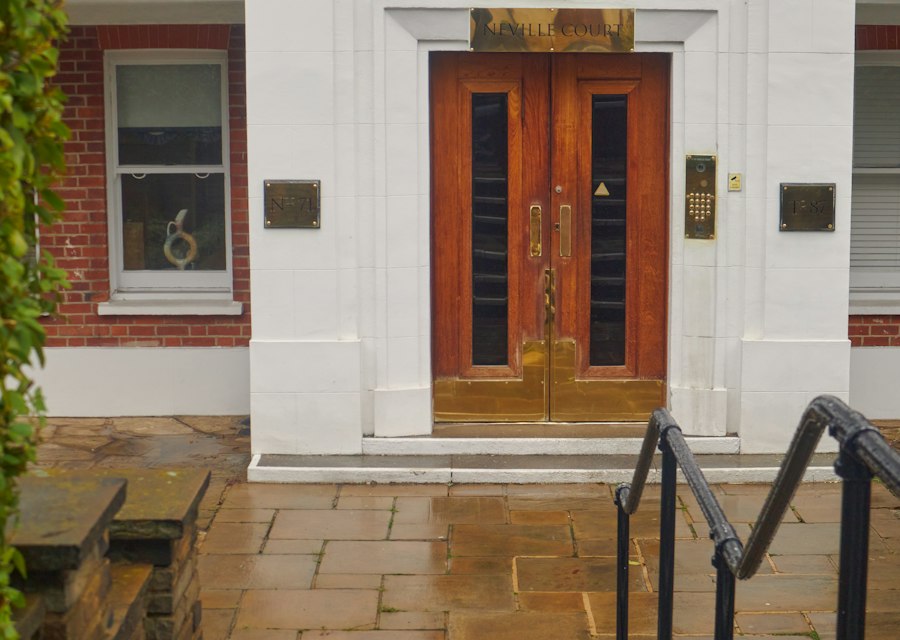 Red brick building with a wooden door
