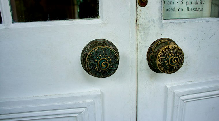 White wooden door with brass door knob